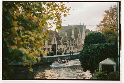Bruges medieval canals with historic buildings and boat tours