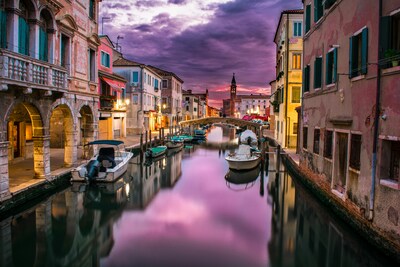 Venice canals with gondolas, historic bridges and traditional Italian waterways